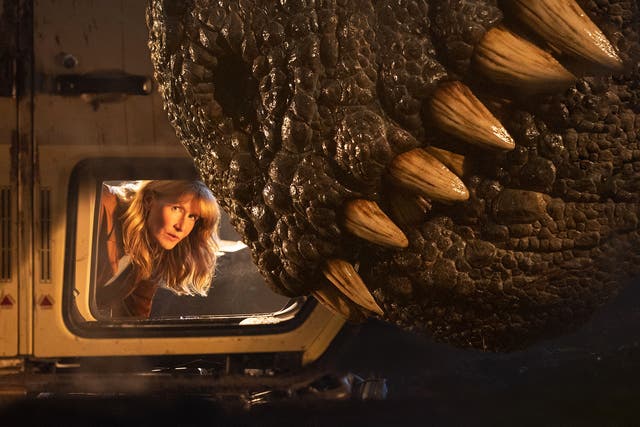 <p>Laura Dern and a really big dinosaur in ‘Jurassic World Dominion’ </p>