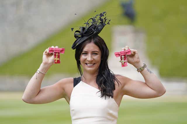 Olympic curler Eve Muirhead holds her MBE and OBE following an investiture ceremony at Windsor Castle (Andrew Matthews/PA)