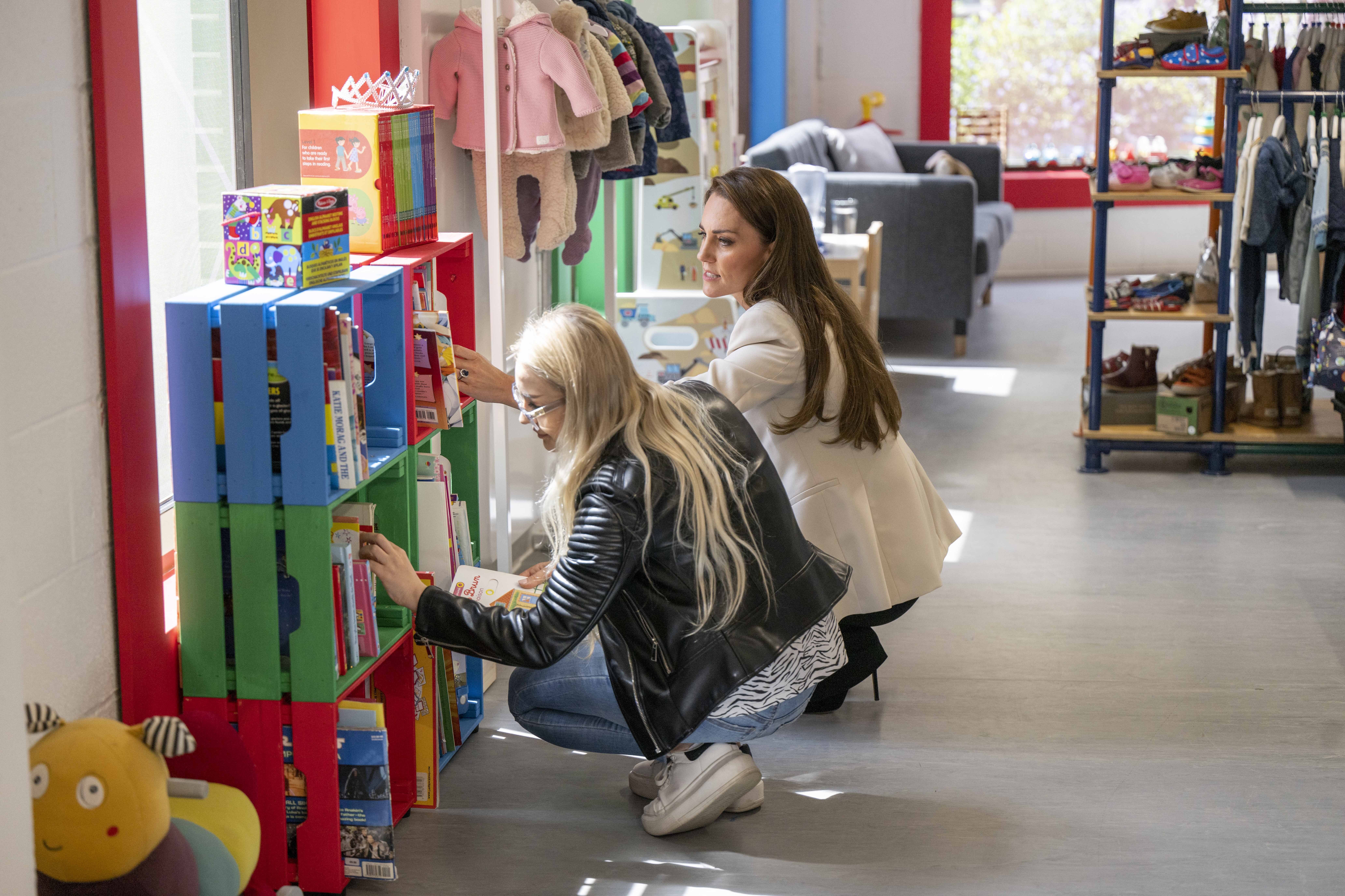 The Duchess of Cambridge with a young mum called Sara during a visit to Little Village’s hub in Brent to hear how the baby bank is supporting local families (Paul Grover/Daily Telegraph/PA)