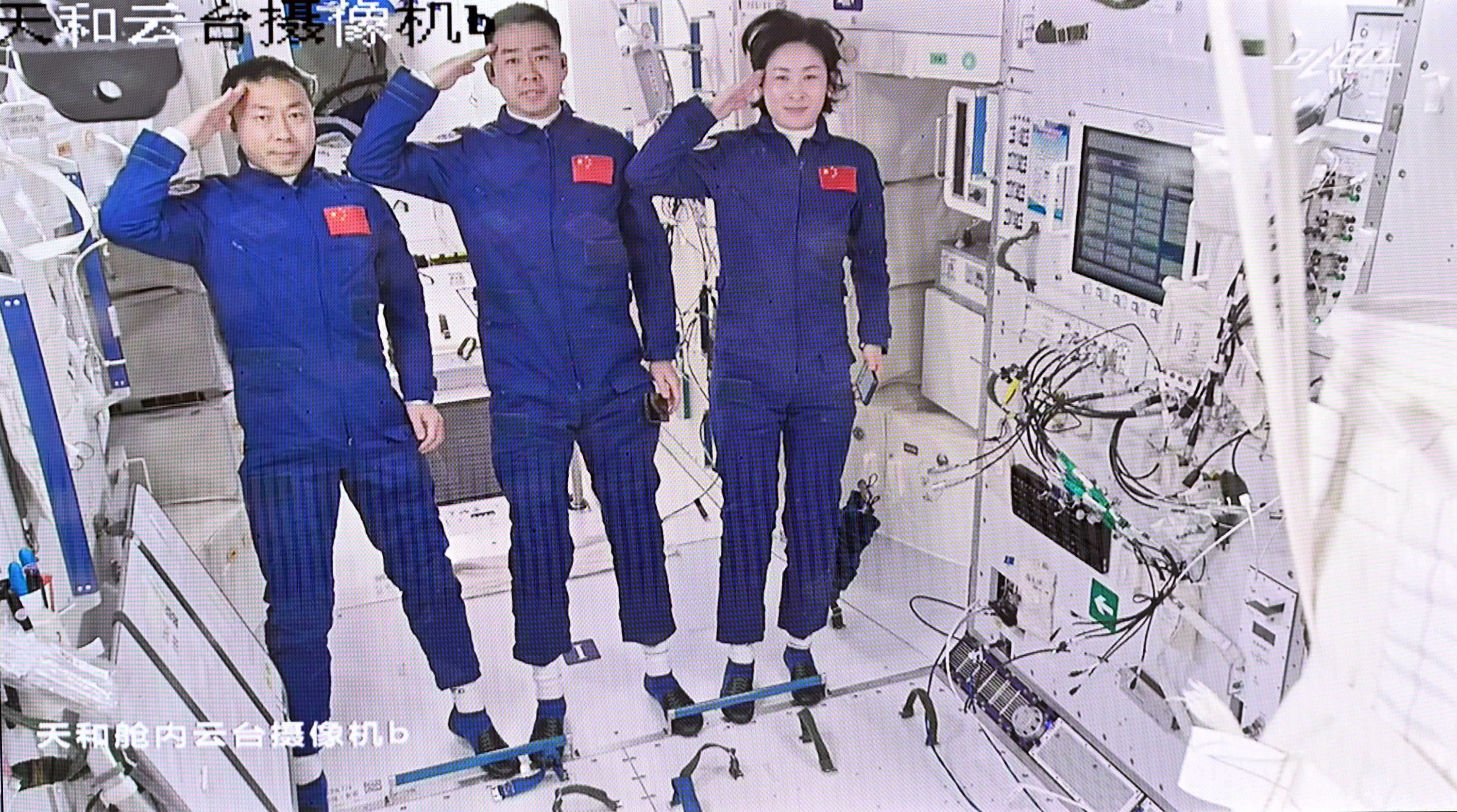 Astronauts Cai Xuzhe, Chen Dong and Liu Yang (from left) wave to the command centre after entering the Tianhe core module of China’s Tiangong space station on 5 June