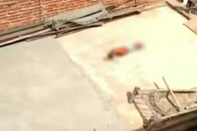 <p>A viral video shows a five-year-old girl lying on the terrace of her Delhi house in the sweltering heat, her hands tied </p>