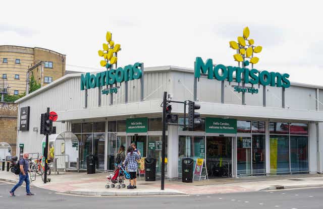 The UK competition regulator has said the takeover of Morrisons by CD&R can be completed after agreeing to the US owner selling dozens of petrol stations (Ian West/PA)