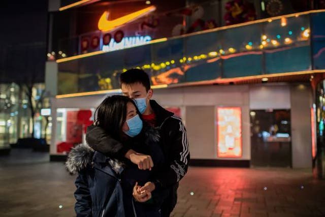 <p>Representative image: A couple in China at  shopping mall in the Sanlitun area in Beijing</p>