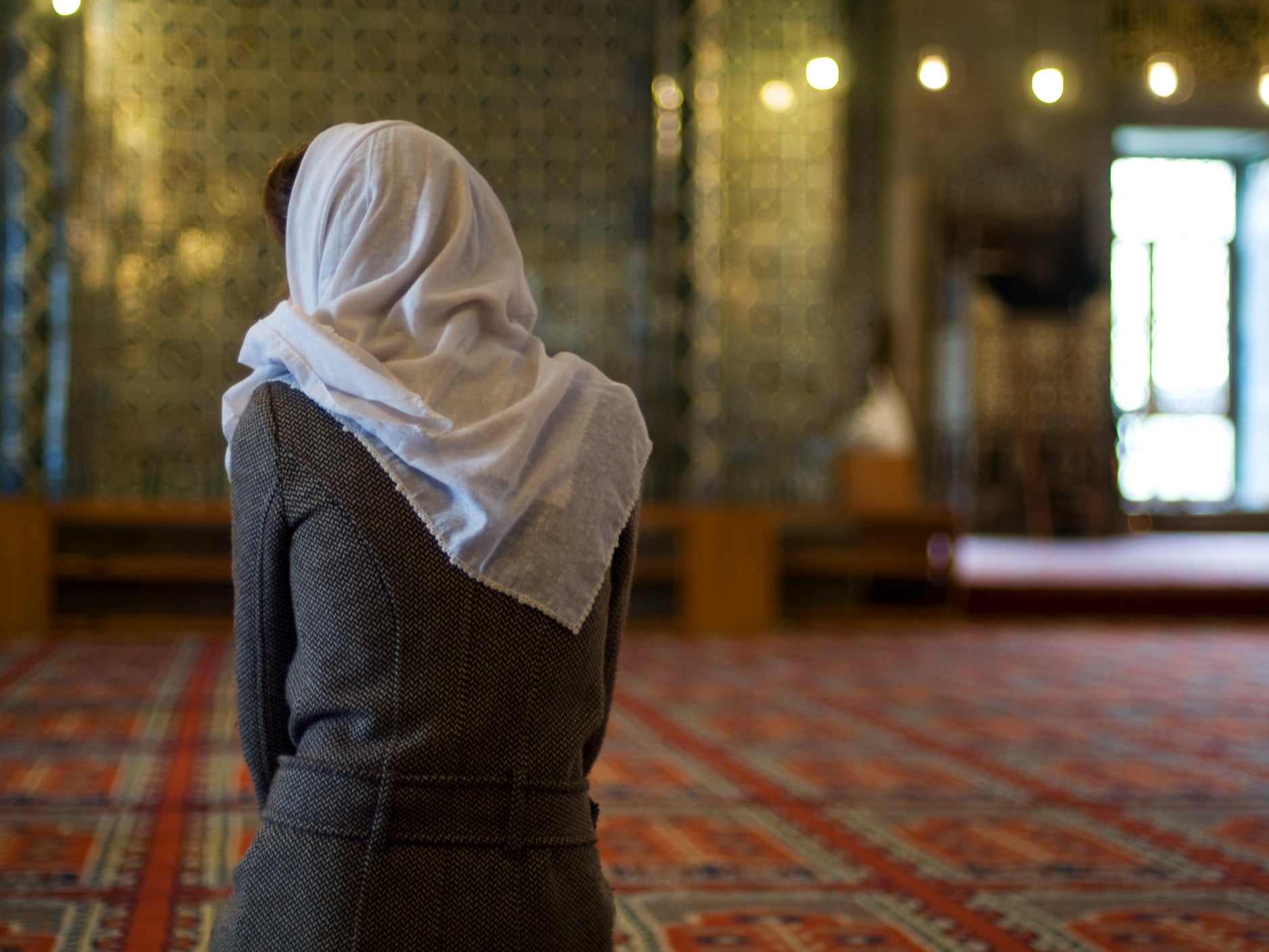 Girls adjust their headscarves before an Islamic prayer service for News  Photo - Getty Images