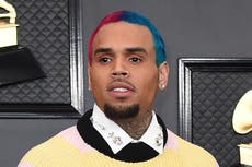 Chris Brown defends taking risqué photos with fans at concert meet-and-greets
