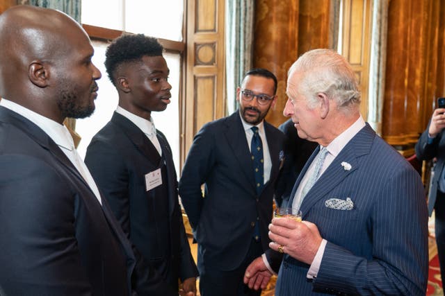 The Prince of Wales meets footballer Bukayo Saka (second from left) at a reception at Buckingham Palace (Dominic Lipinski/PA)