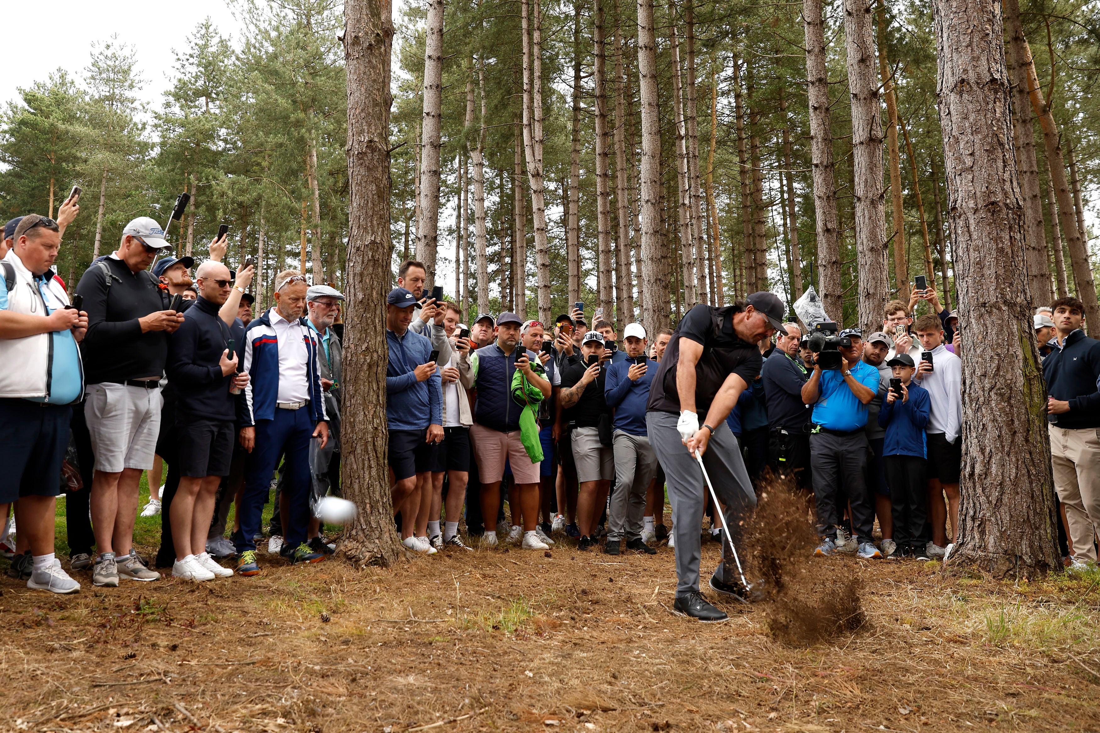 Mickelson plays out from the forest on hole three