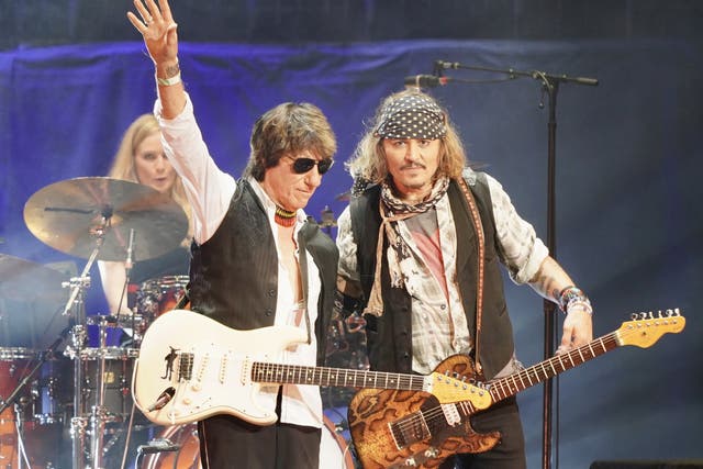 <p>Johnny Depp with Jeff Beck (Raph Pour-Hashemi/PA)</p>