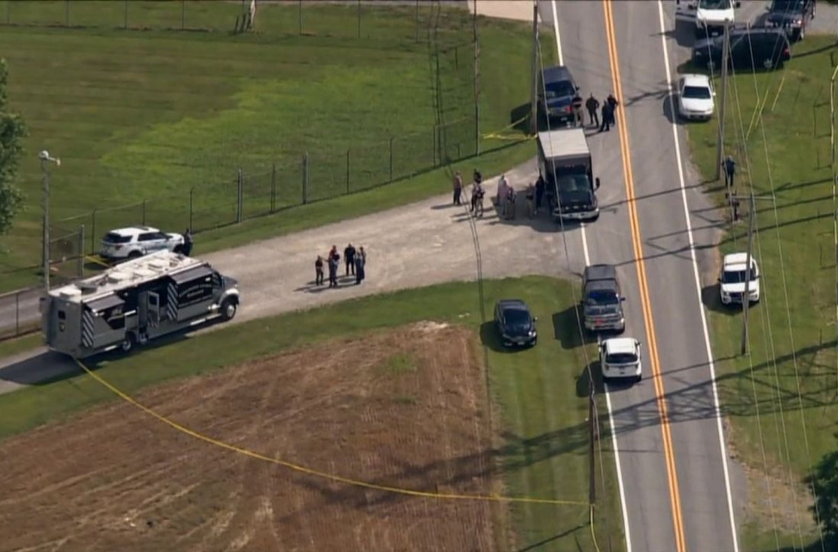 Maryland mass shooting – live: Three dead as video appears to show police exchange fire with suspect