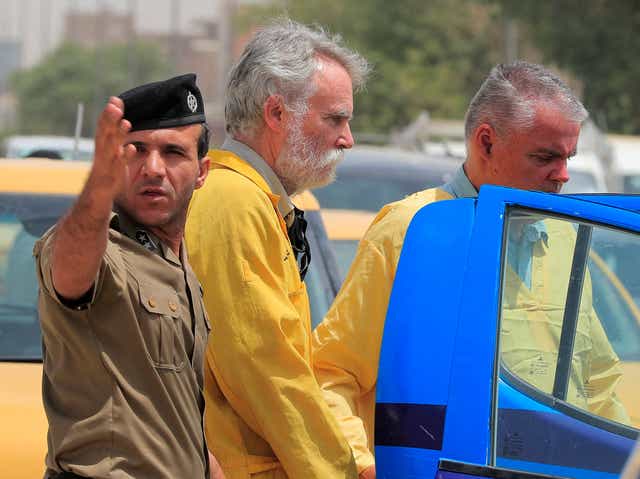 <p>Jim Fitton (centre) has been jailed for 15 years in Iraq</p>