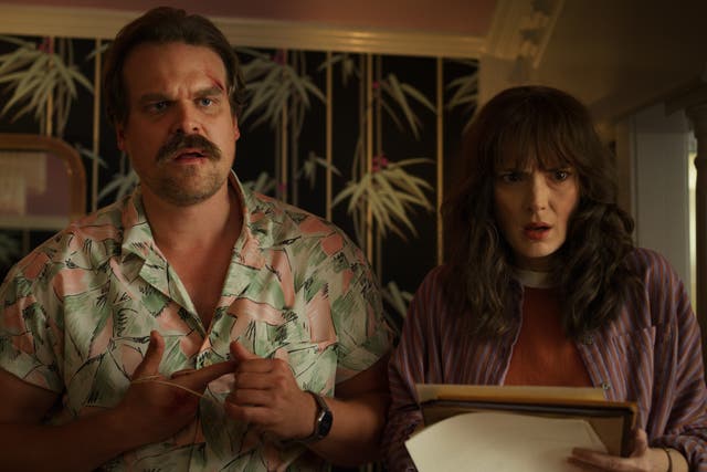 <p>David Harbour with co-star Winona Ryder in ‘Stranger Things’ (Netflix/PA)</p>