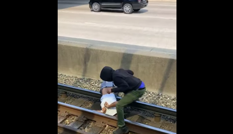 A Chicago commuter braved the third rail to rescue a man who had fallen onto the tracks