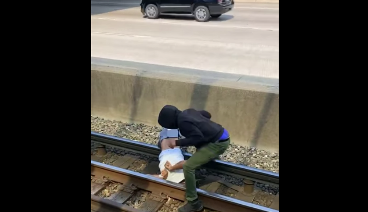Video shows Chicago commuter jumping onto tracks to save man who fell: &lsquo;I could feel the shocks&rsquo;