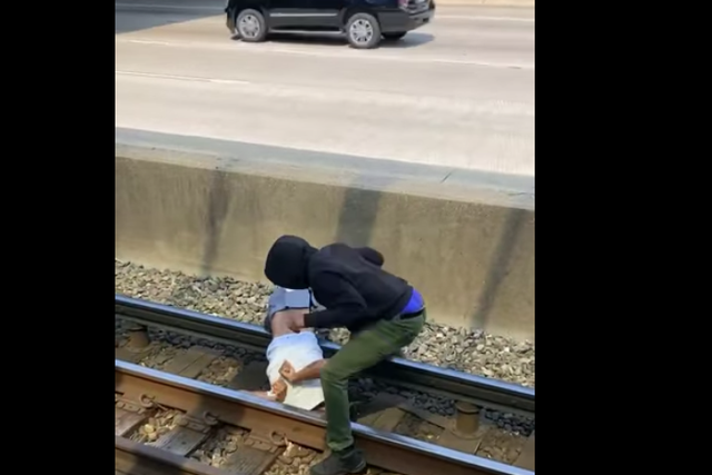 <p>A Chicago commuter braved the third rail to rescue a man who had fallen onto the tracks</p>