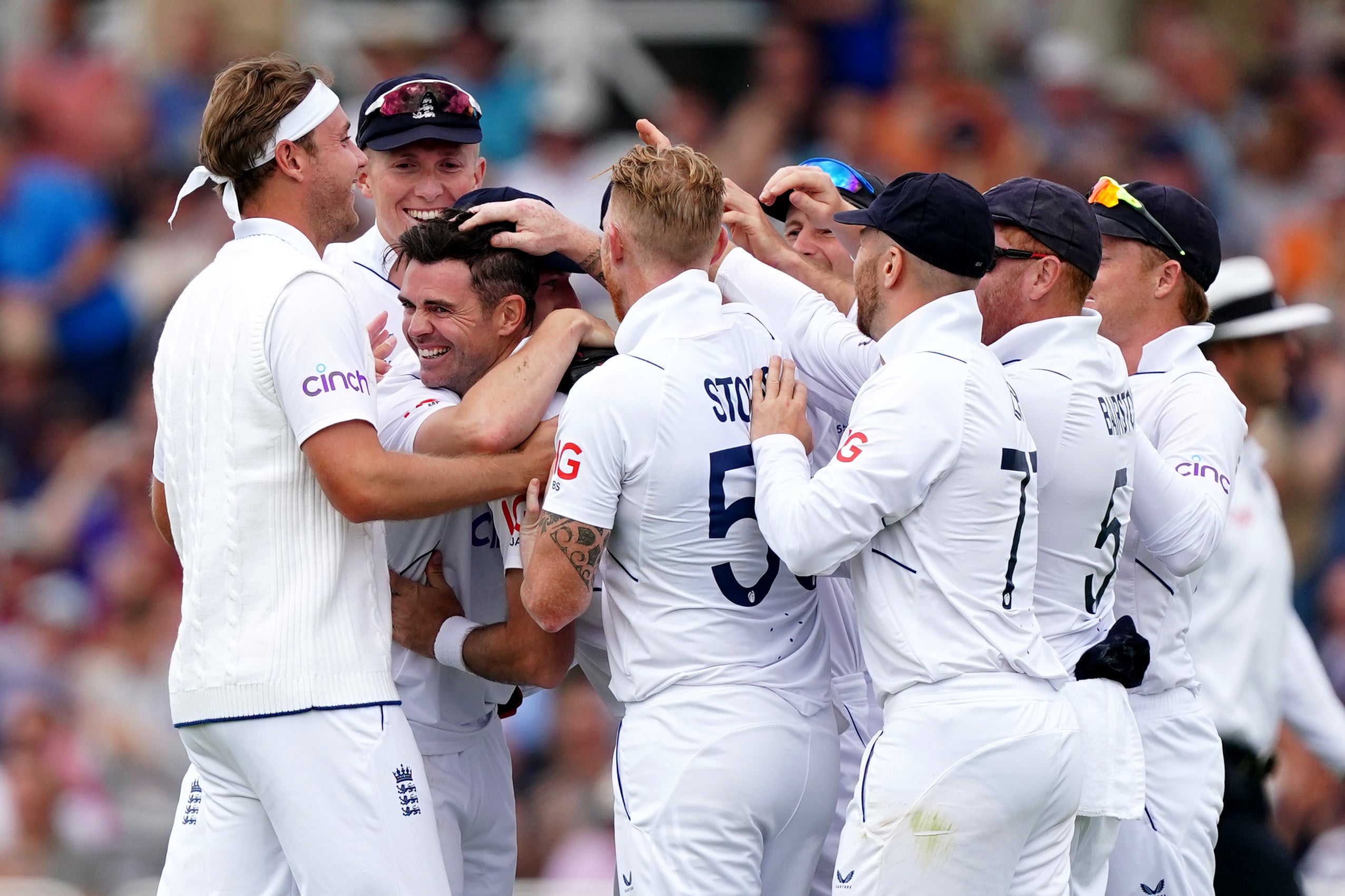 James Anderson (centre) is congratulated by teammates after taking the wicket of New Zealand’s Tom Latham (Mike Egerton/PA)