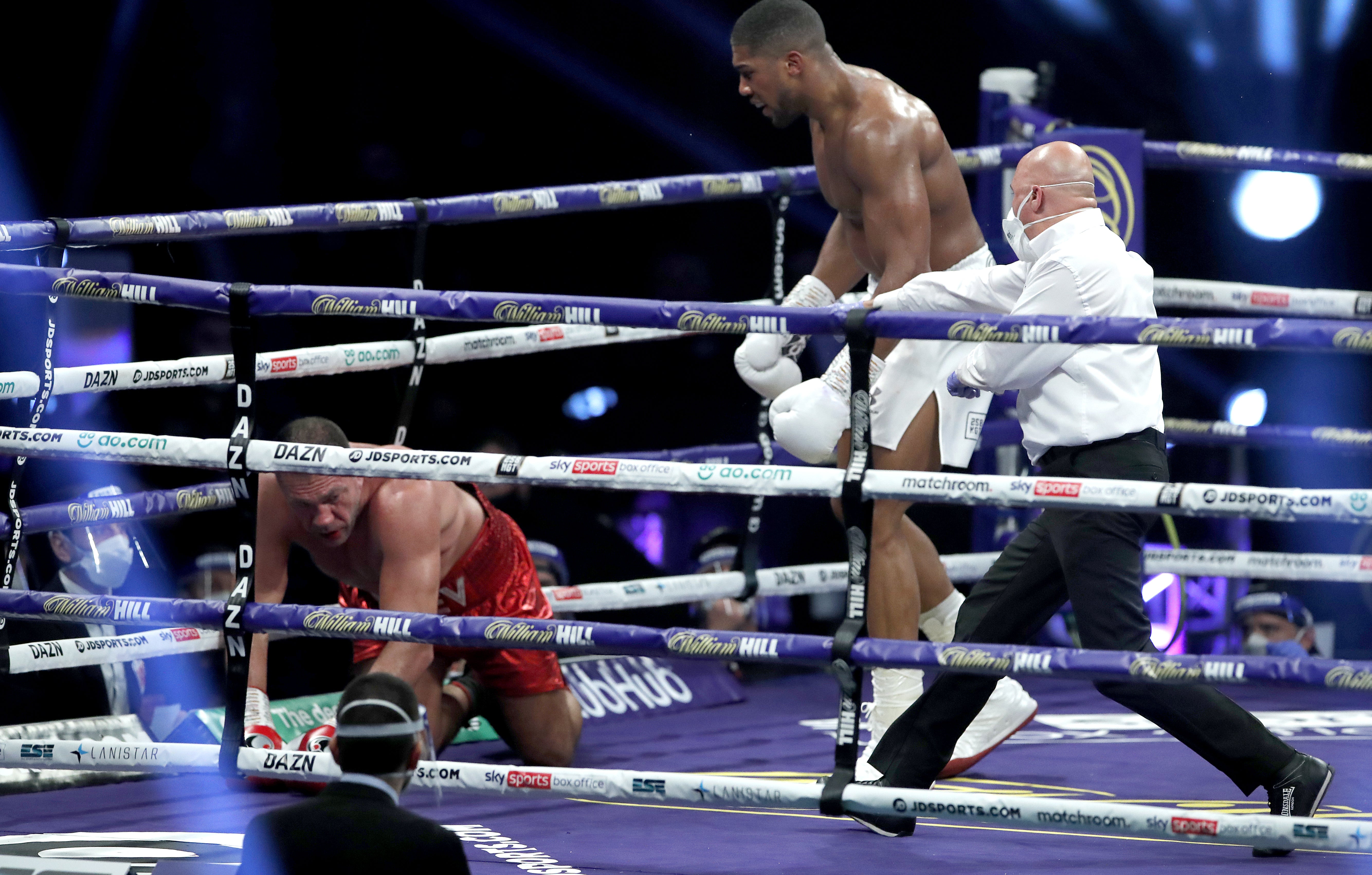 Joshua knocked down Kubrat Pulev multiple times before forcing a stoppage