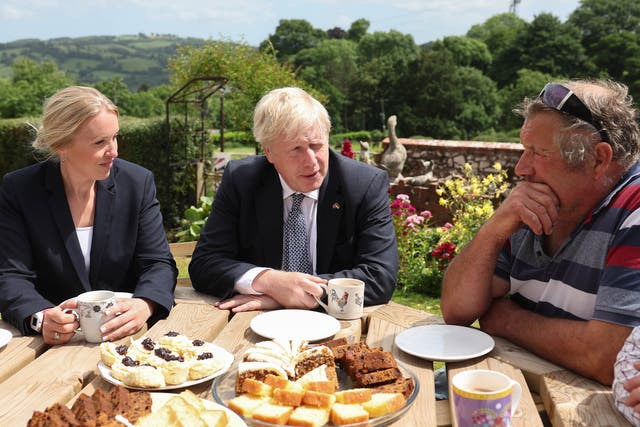<p>Boris Johnson and Tory candidate Helen Hurford (left) at Ditchetts Farm in the Tiverton and Honiton constituency </p>