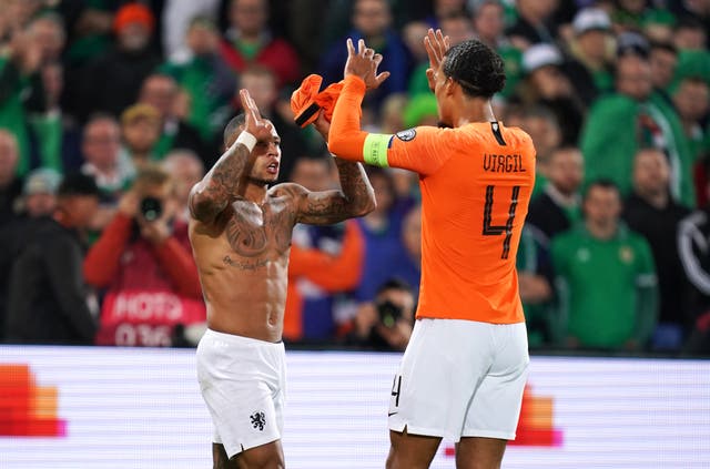 Netherlands’ Memphis Depay (left) celebrates scoring his side’s third goal of the game with Virgil van Dijk during the UEFA Euro 2020 qualifying, group C match at the Stadion Feijenoord, Rotterdam.