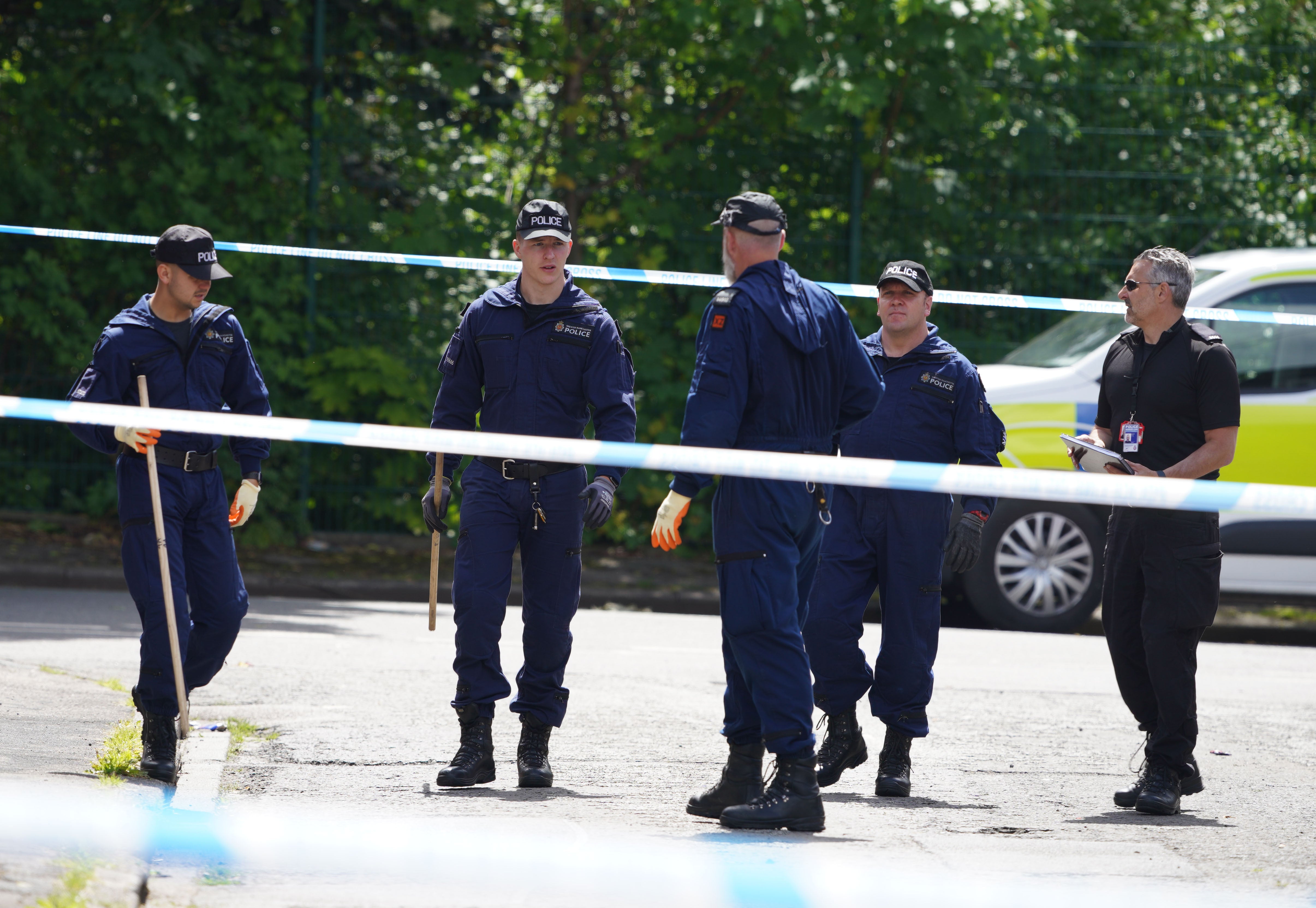 <p>Police at the scene of the stabbing in Bednal Avenue, Miles Platting </p>