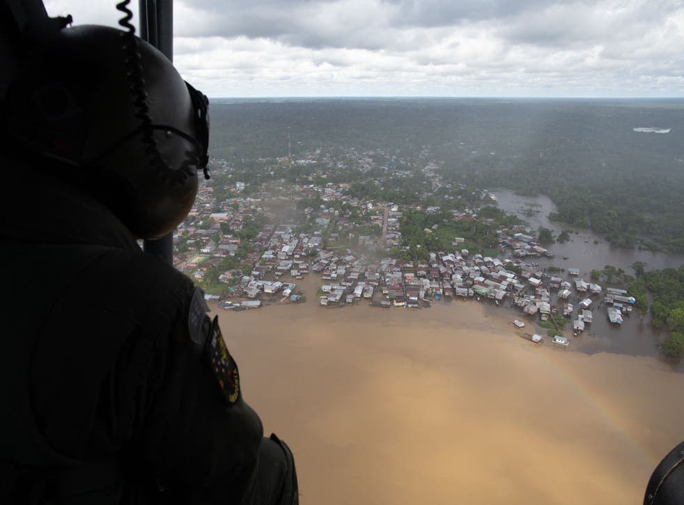 <p>A helicopter patrols Atalaia do Norte in the search for missing Bruno Pereira and Dom Phillips</p>