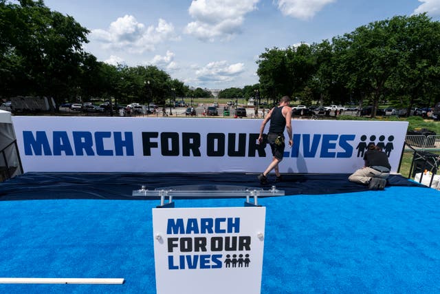 <p>Workers set up for the March for Our Lives rally on the National Mall on Friday </p>