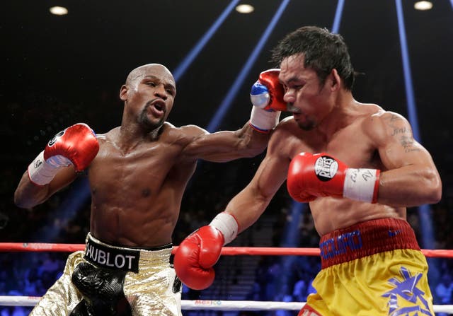 <p>Floyd Mayweather (left) and Manny Pacquiao during their 2015 clash </p>