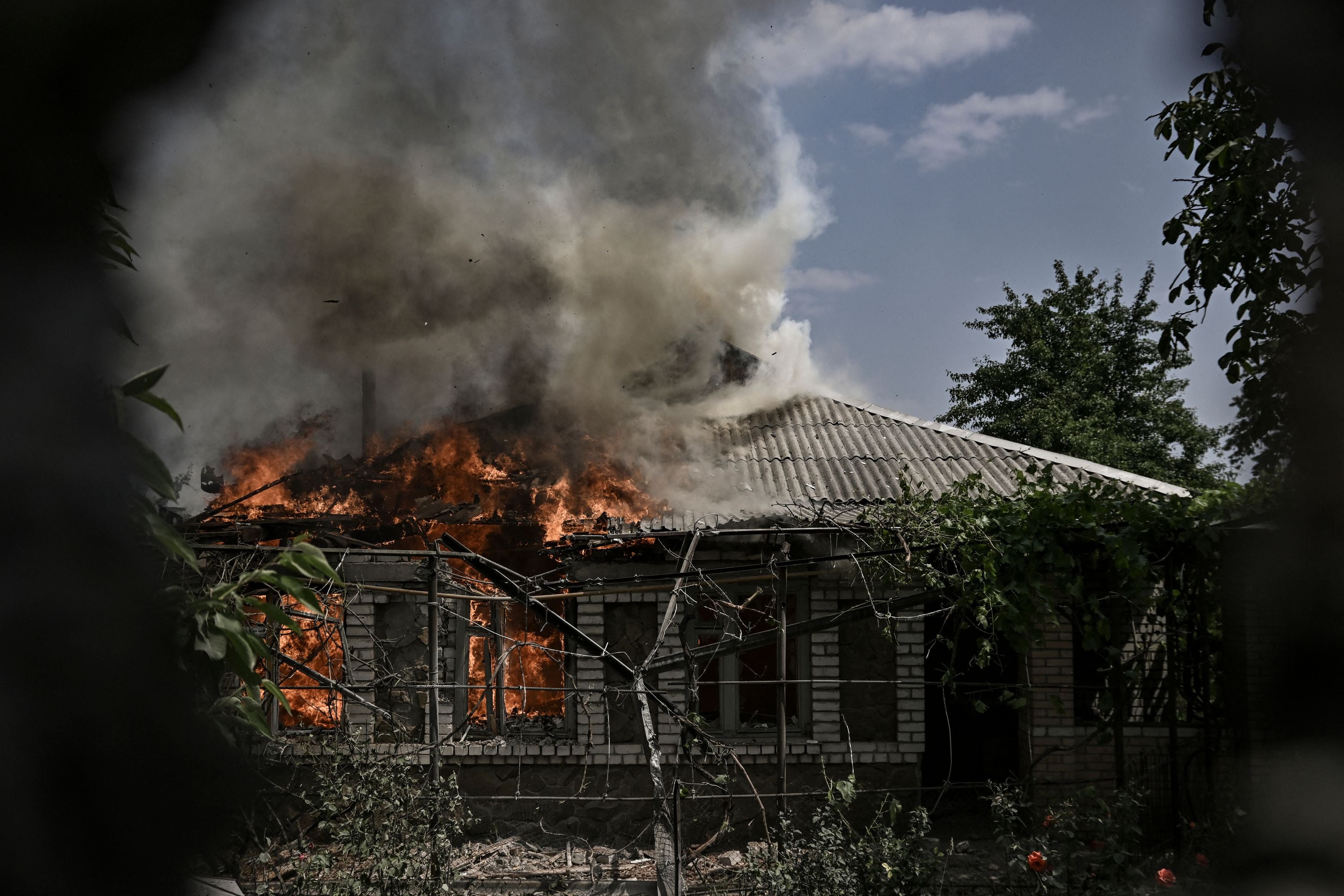A house burns after being shelled during an artillery duel between Ukrainian and Russian troops in Lysychansk on Saturday
