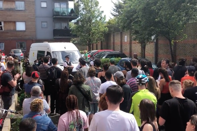 <p>Protesters gathered to stop a van leaving Peckham containing a man arrested on suspicion of immigration offences </p>