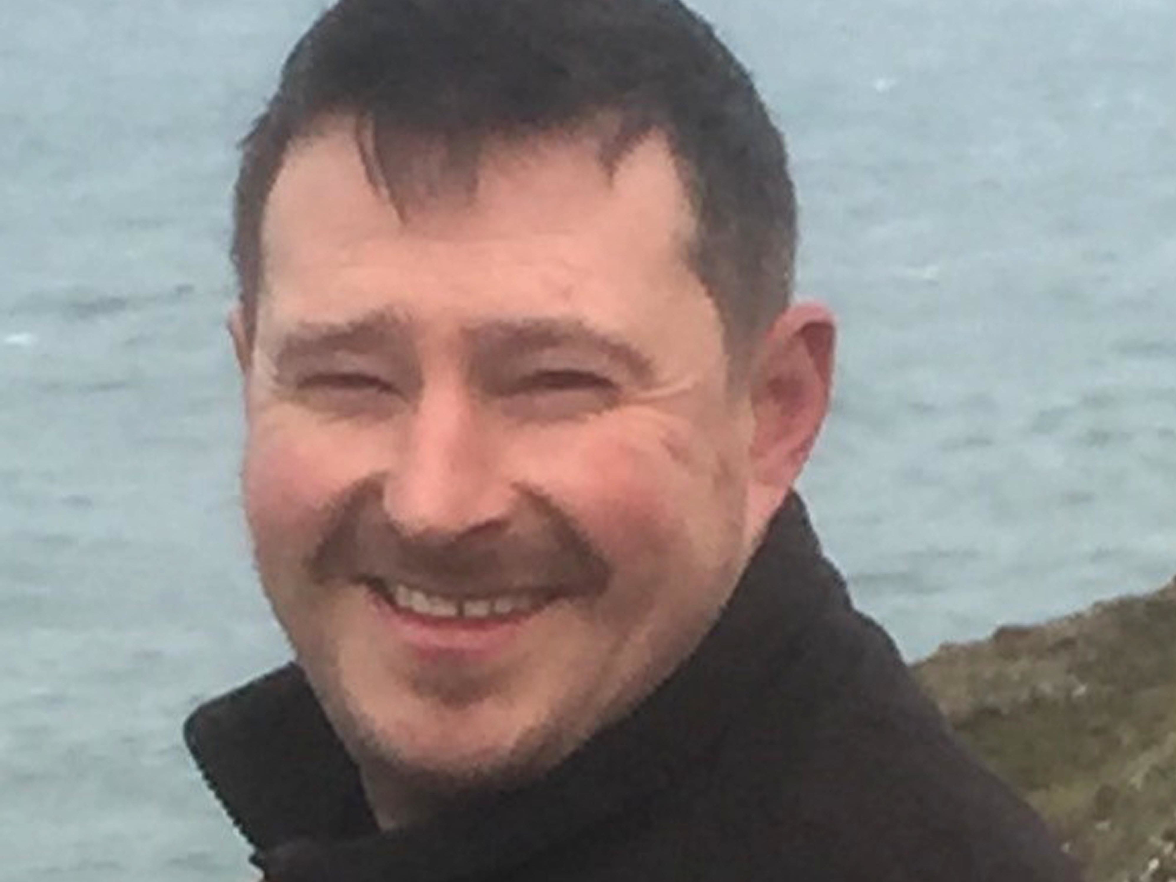Hywel Morgan (pictured) died after rescuing a group of children caught in a riptide