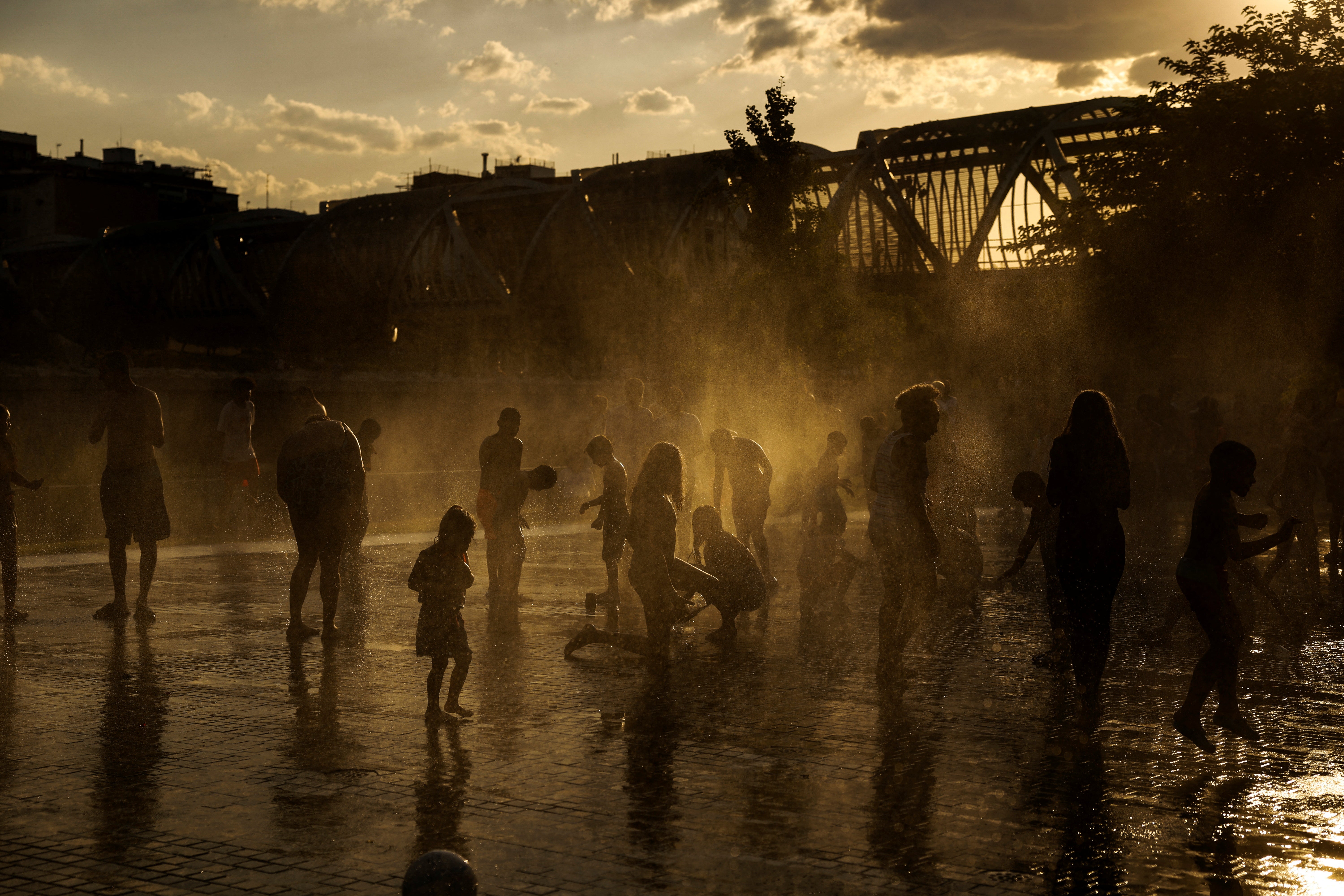 People cool off during the heatwave in Madrid, Spain, on 11 June 2022