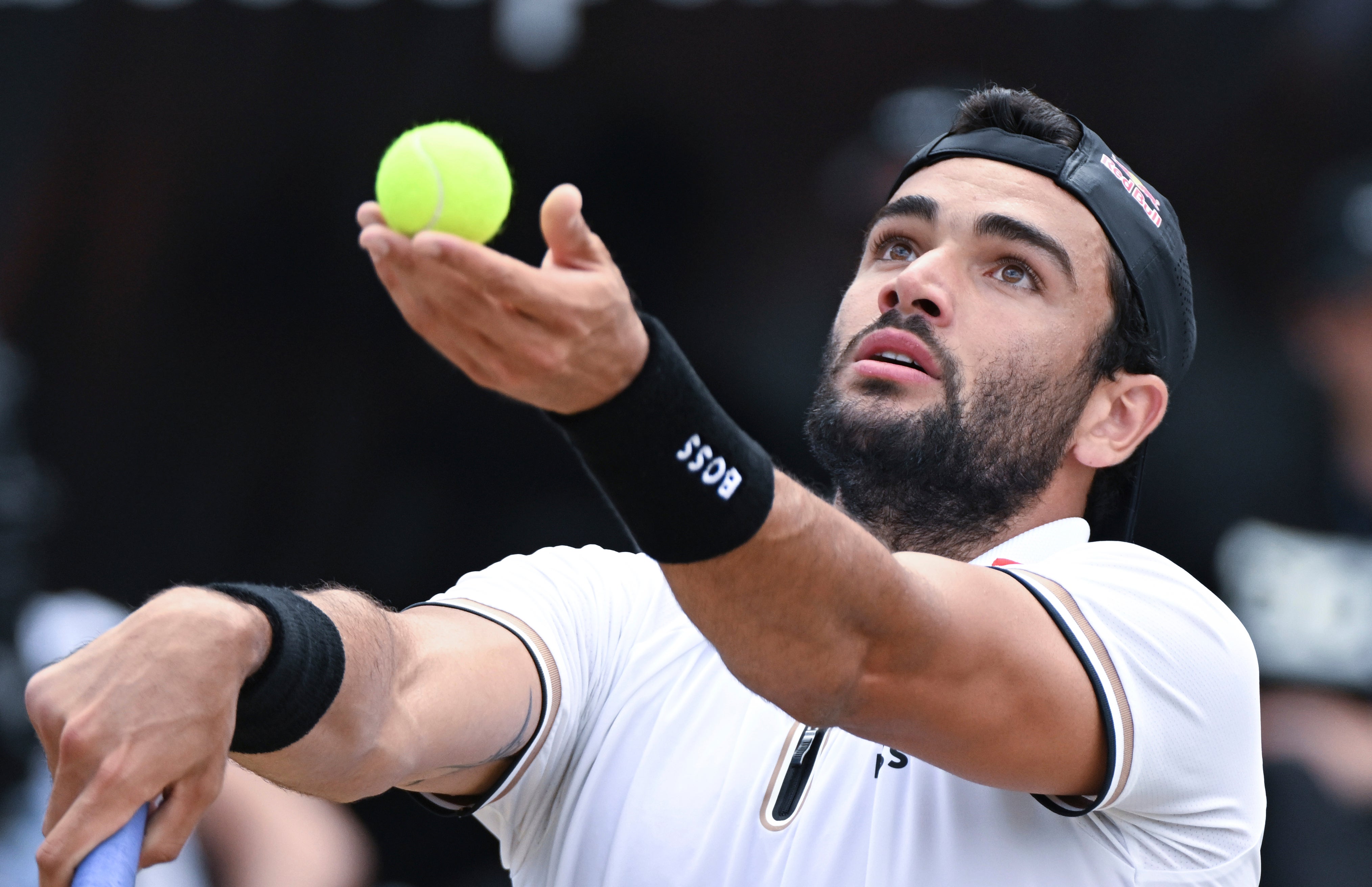 Matteo Berrettini serves to Britain's Andy Murray