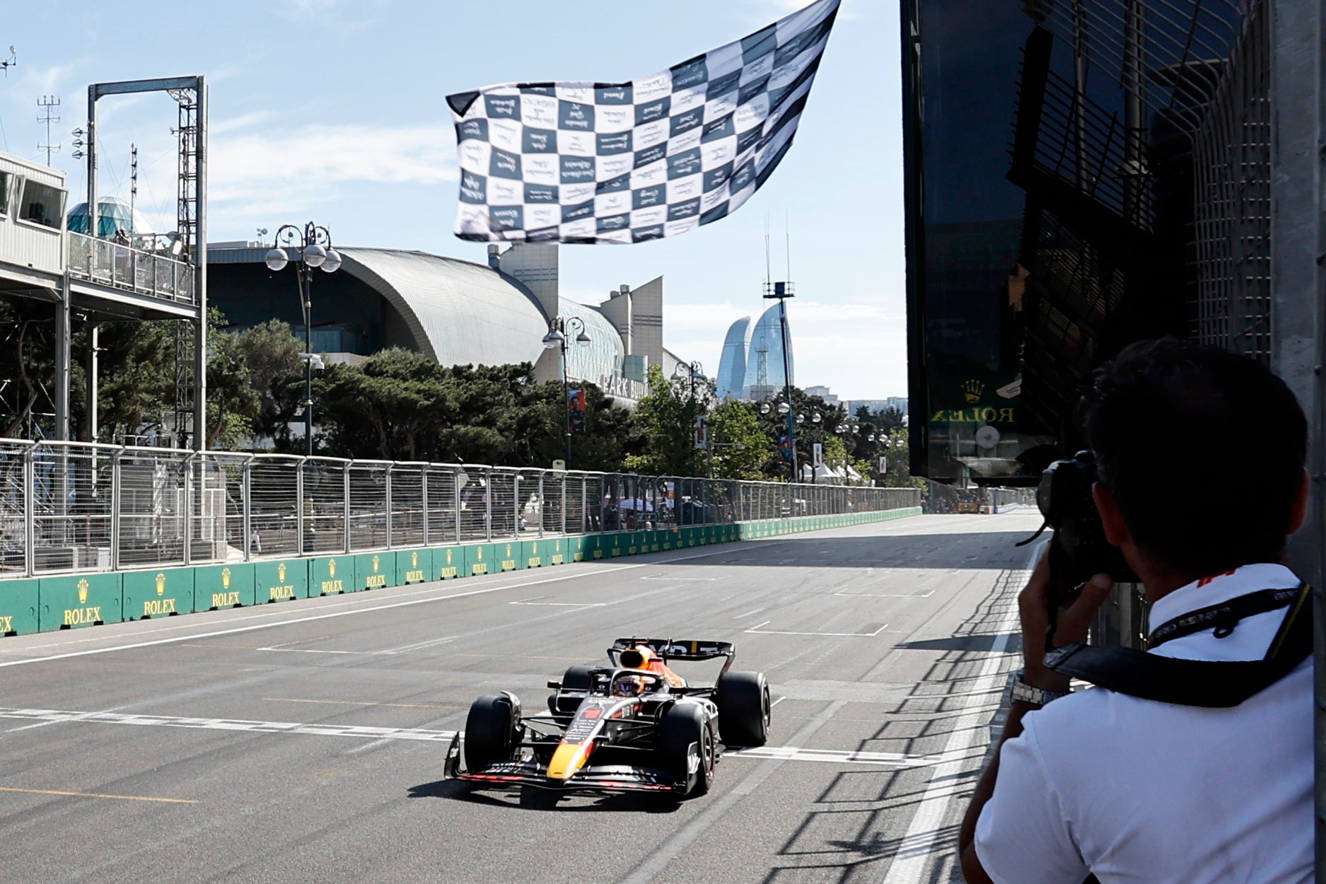 Max Verstappen takes the chequered flag in Baku (Hamad Mohammed/AP).