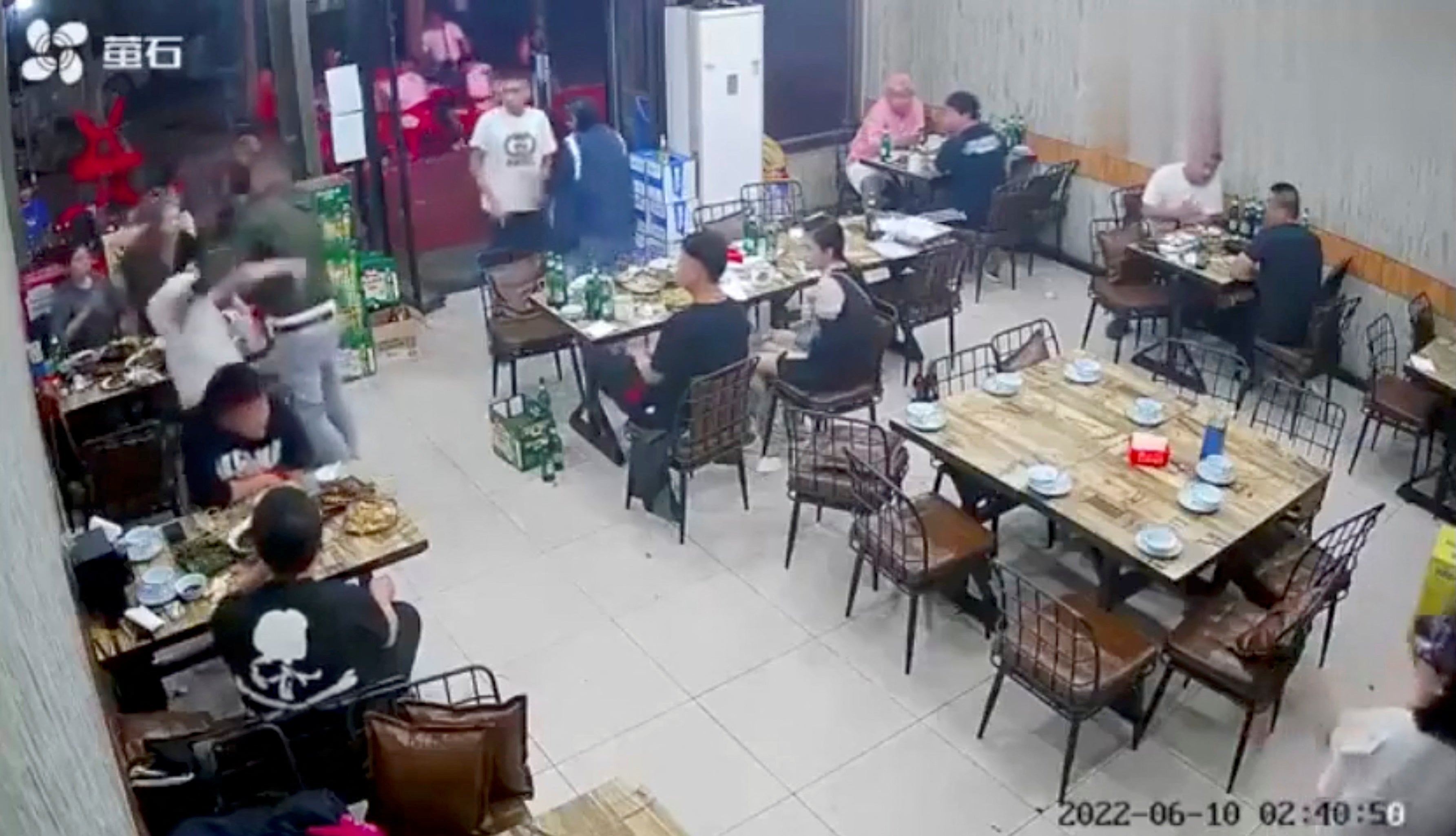 A man assaults a woman at a restaurant in the northeastern city of Tangshan, China