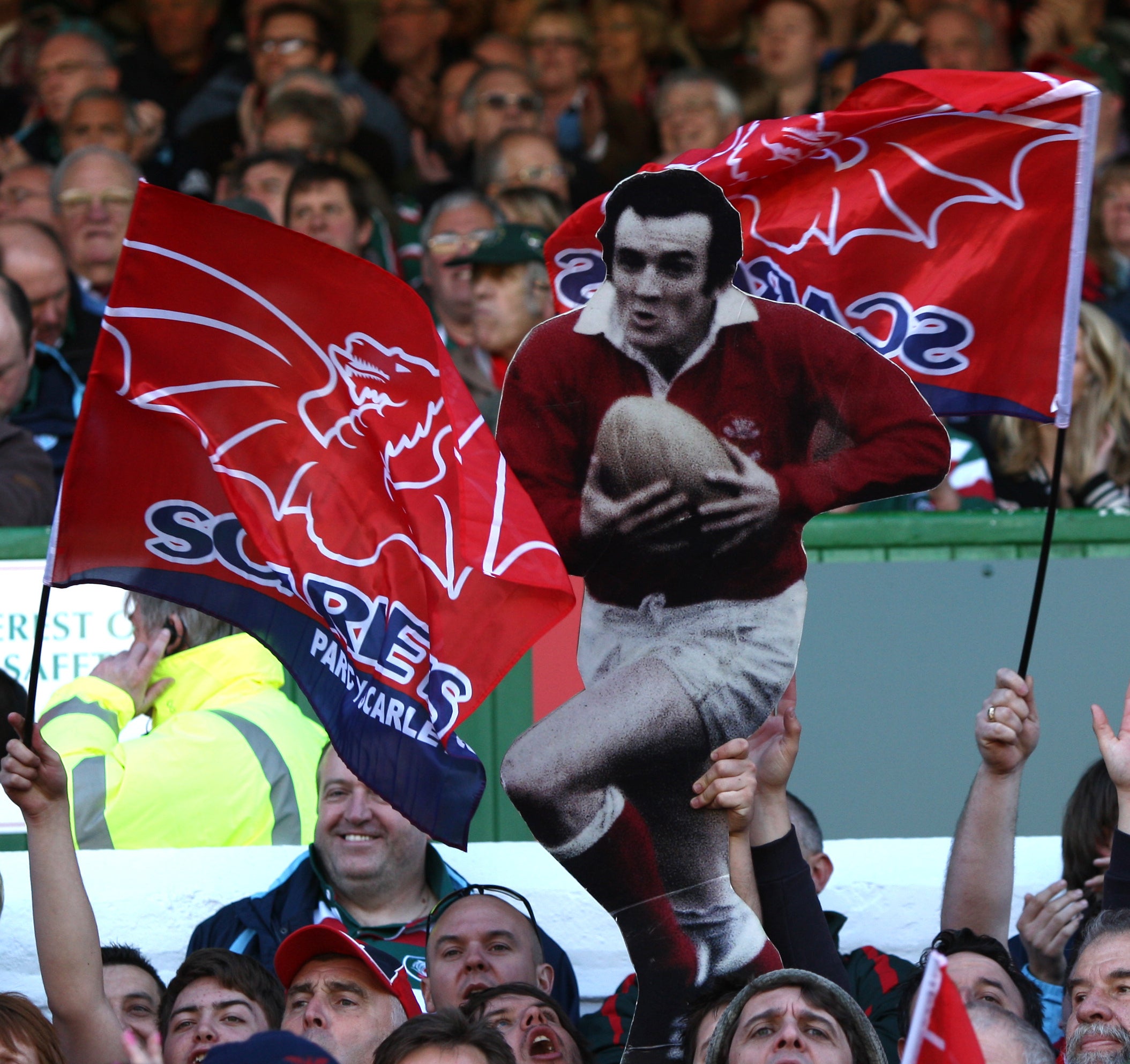 Scarlets fans hold up a cardboard cut-out of Phil Bennett (David Davies/PA).