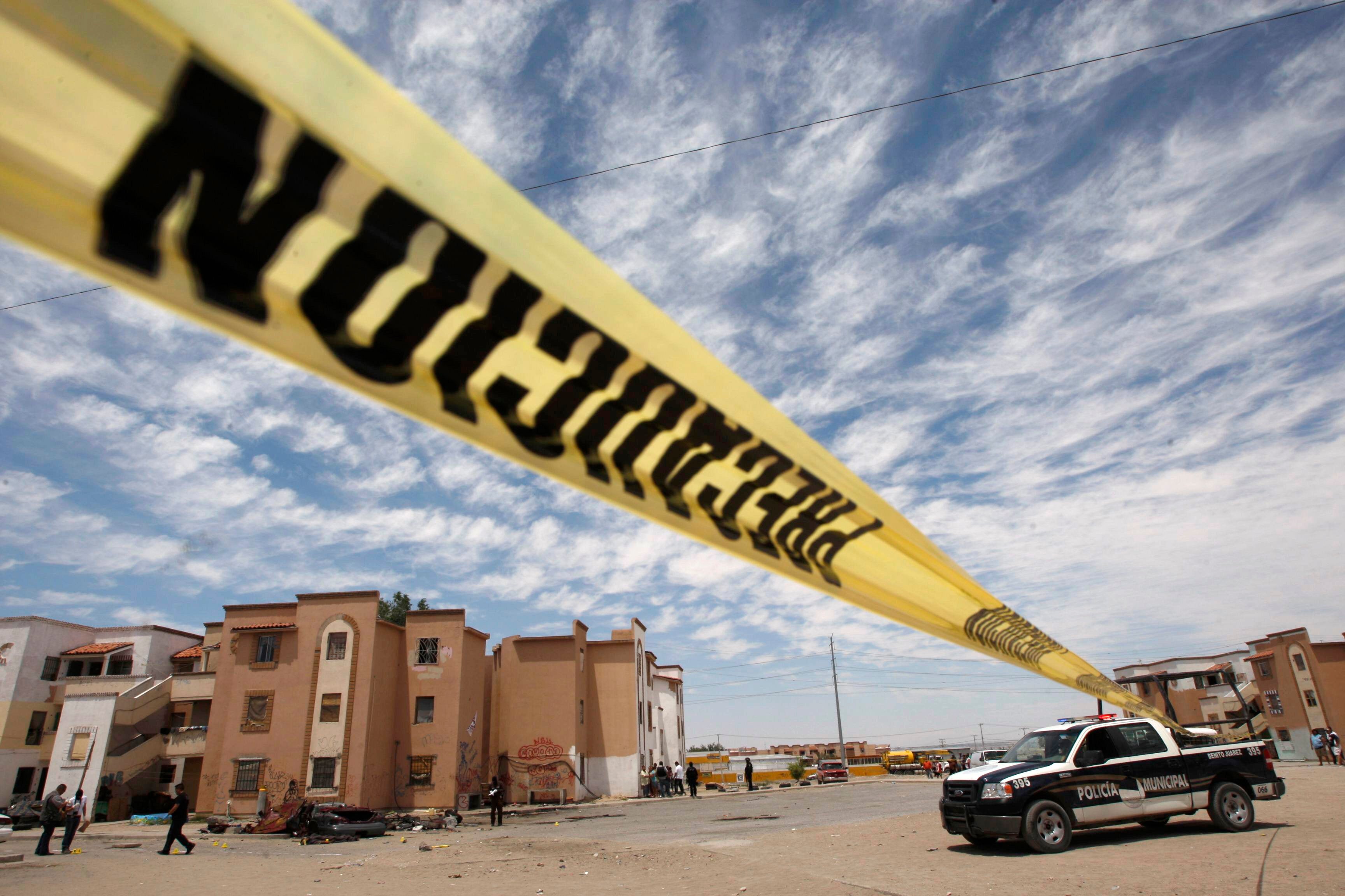 <p>Representational image: A police line marks a crime scene in Mexico </p>