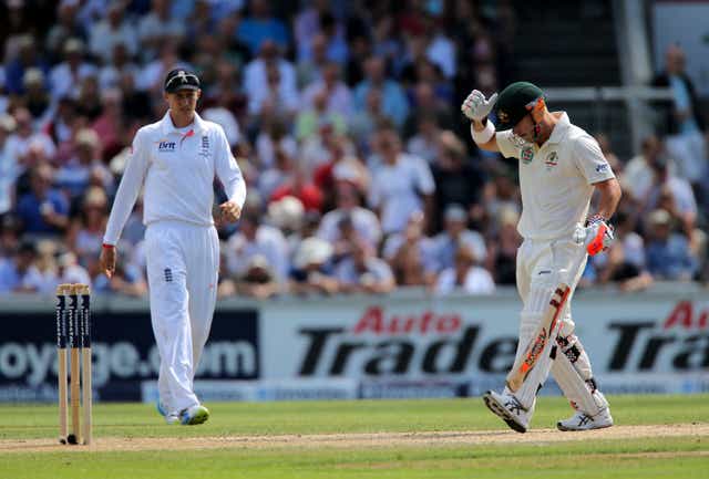 David Warner looks away from England’s Joe Root during the third Ashes Test at Old Trafford in 2013 (Nick Potts/PA)
