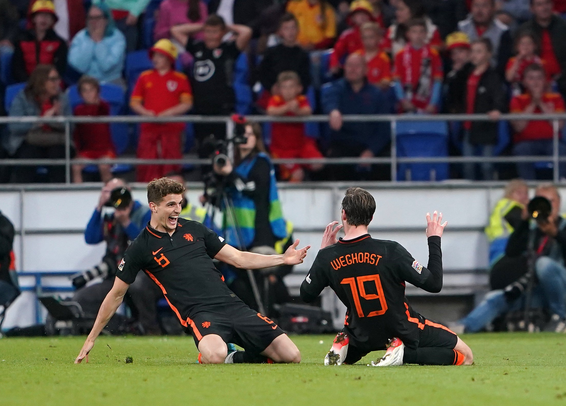 Holland striker Wout Weghorst (right) celebrates with team-mate Guus Til after scoring the Nations League winner against Wales in Cardiff (Zac Goodwin/PA)