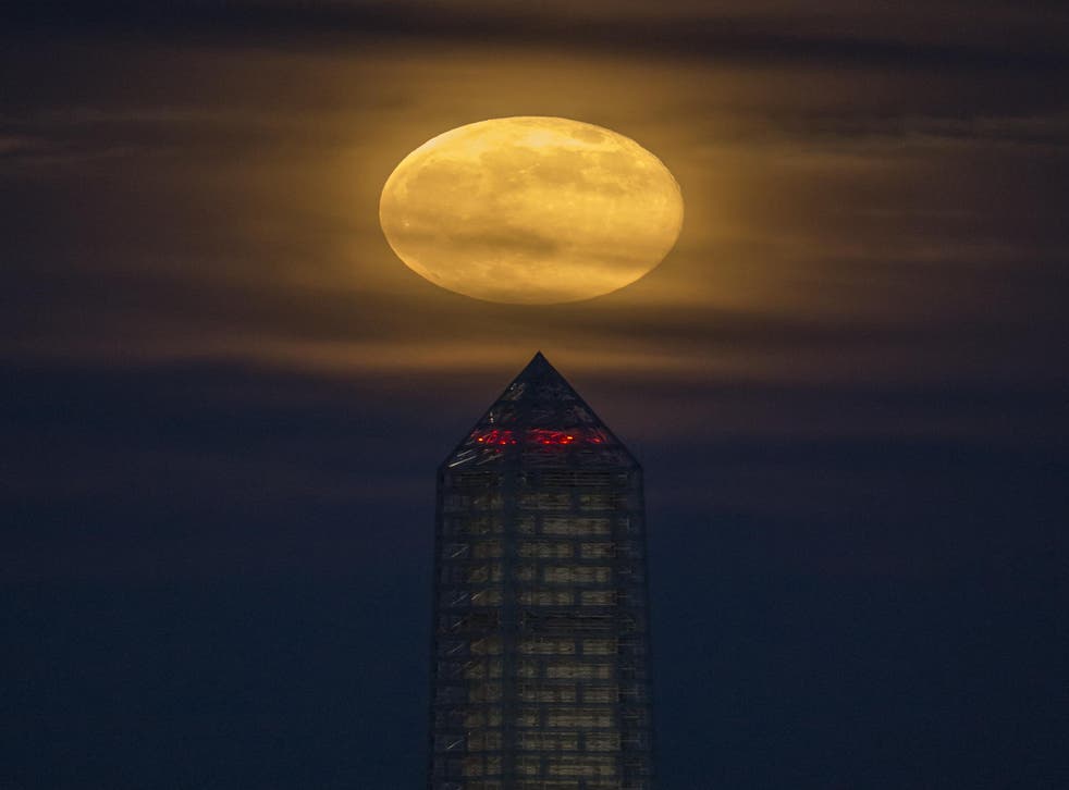 <p>A Super Strawberry Moon seen above the Washington Monument in Washington, D.C. in 2013</p>