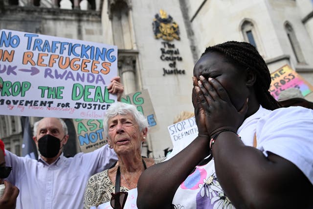 <p>Human rights campaigners react after losing the appeal outside the High Court in London on Monday</p>