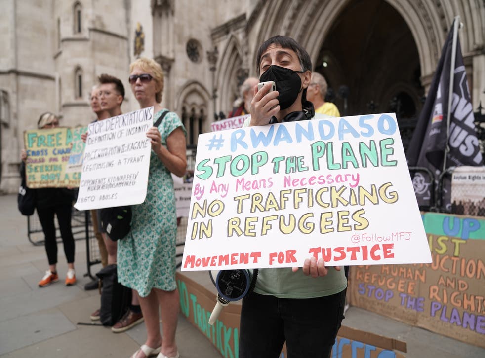 Protesters outside the High Court in London for the ruling on Rwanda deportation flights (Aaron Chown/PA)