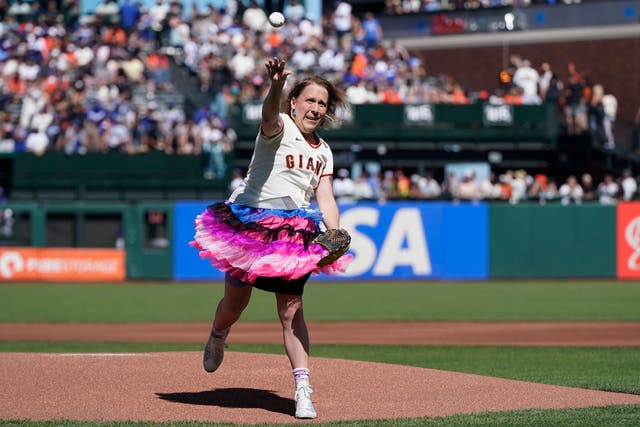 <p>Amy Schneider throws out the ceremonial first pitch on Pride Day in San Francisco </p>