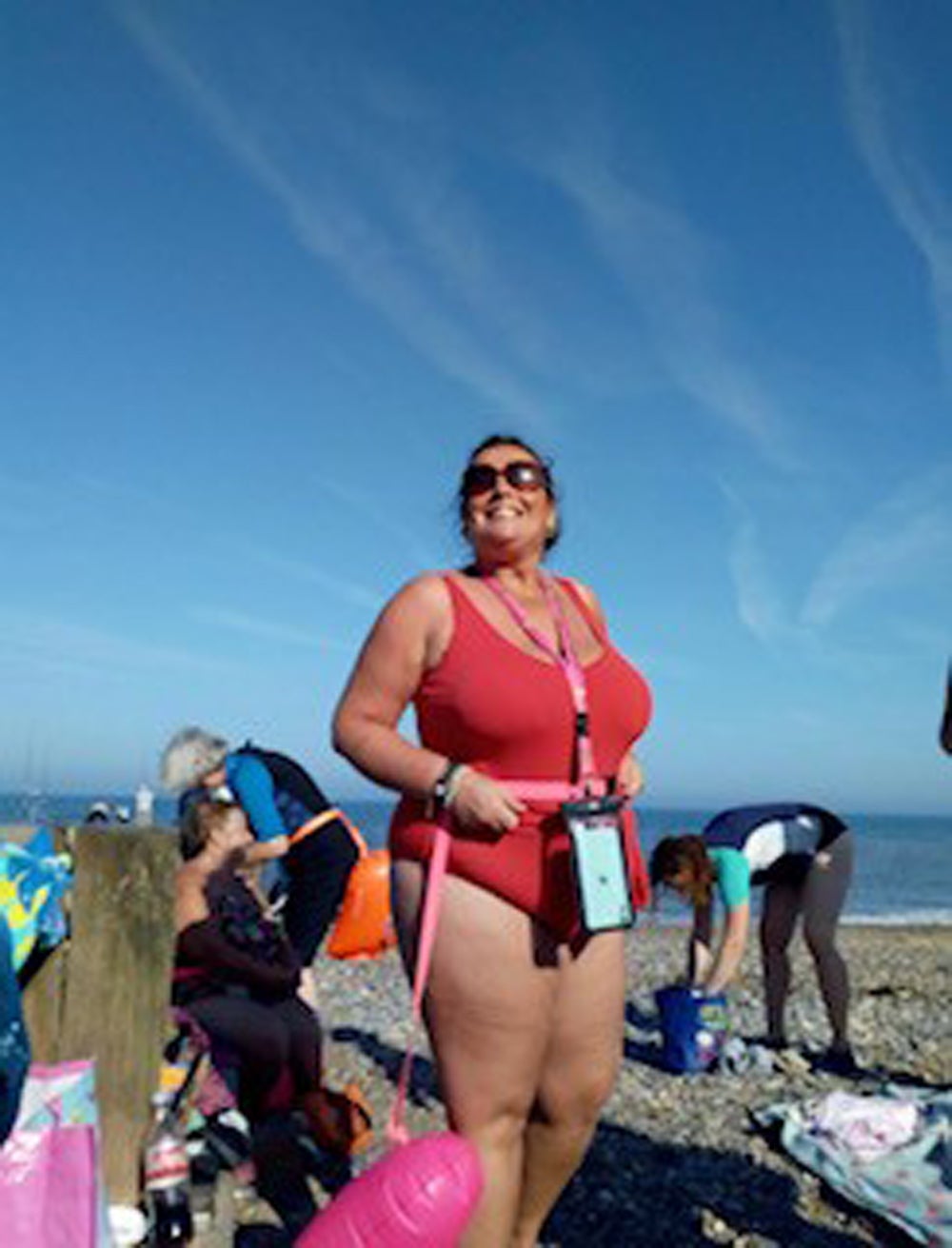Claire Keable, 48, in her pink costume on Hornsea beach last summer (Collect/PA Real Life)