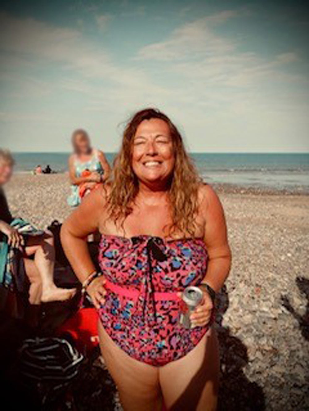 Claire Keable, 48, grinning after a swim in the sea on Hornsea beach (Collect/PA Real Life)