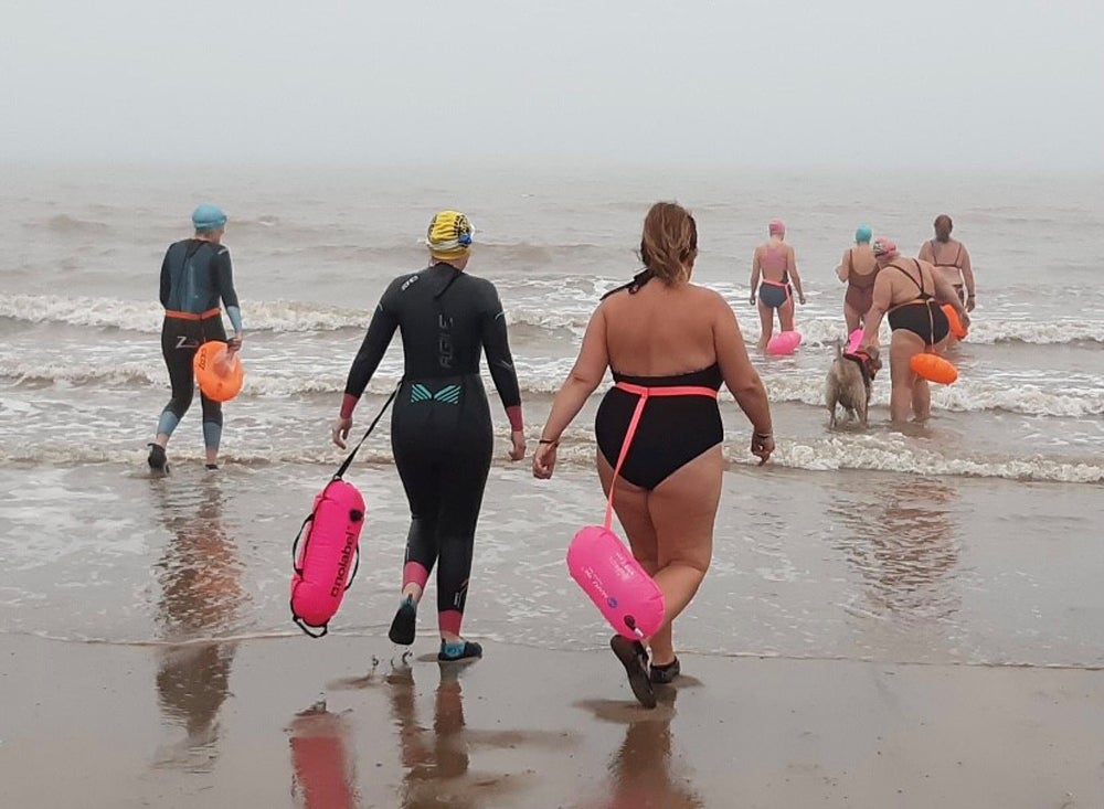 Claire Keable, 48, with fellow open water swimmers in Spring 2021 (Collect/PA Real Life)