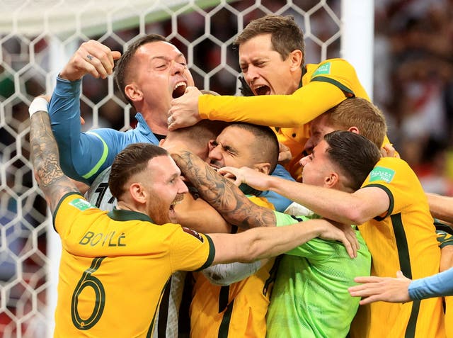 <p>Australia celebrate with goalkeeper Andrew Redmayne</p>