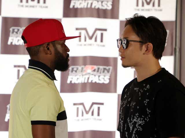 <p>Floyd Mayweather (left) and Mikuru Asakura face off as their fight is announced</p>