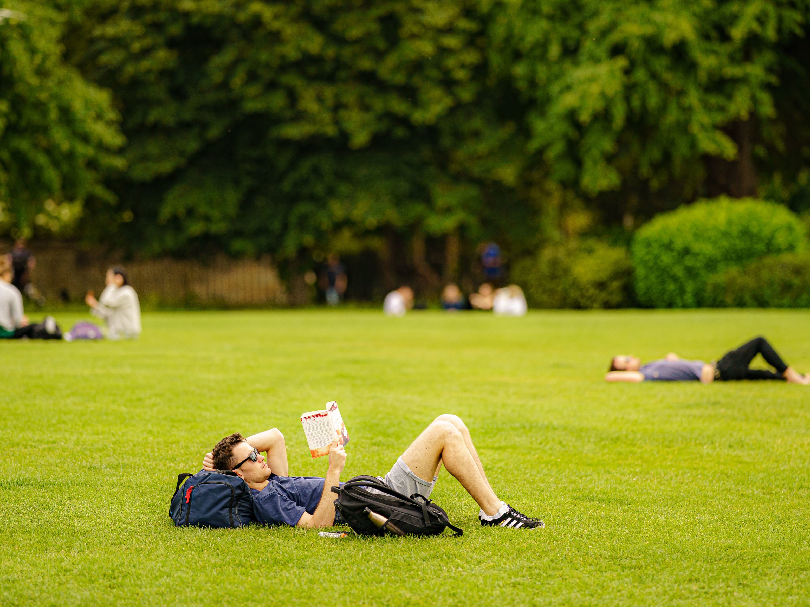 Revellers enjoy the sunshine in a London park