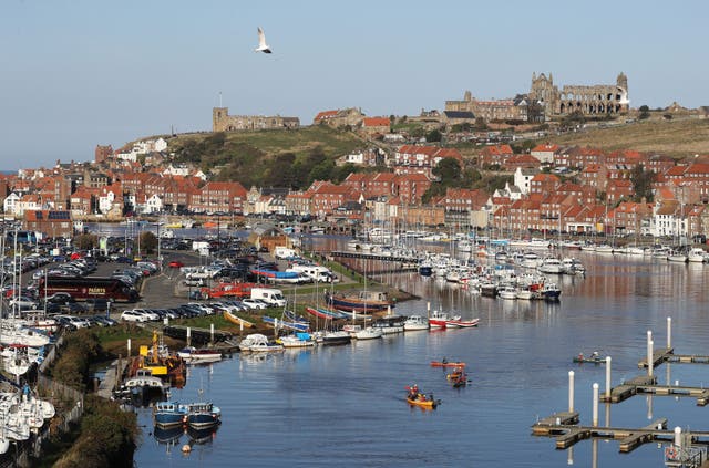 Canoeists in Milton Harbour in the picturesque town of Whitby, North Yorkshire. (Owen Humphreys/PA)