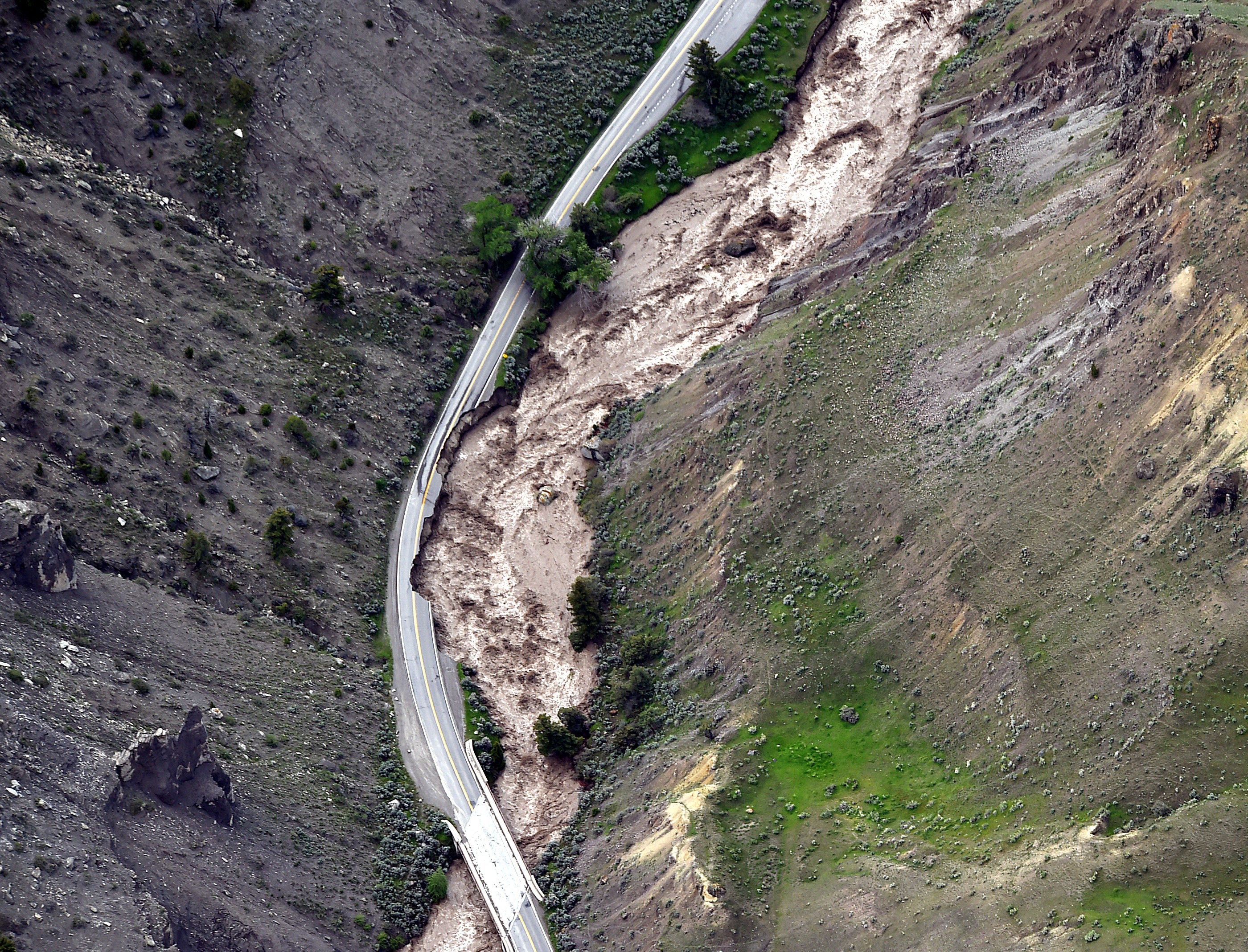 What caused the massive flooding and mudslides in Yellowstone?