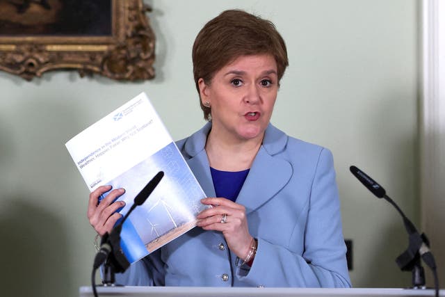 <p>Nicola Sturgeon holds a document promoting Scottish independence at the campaign launch</p>